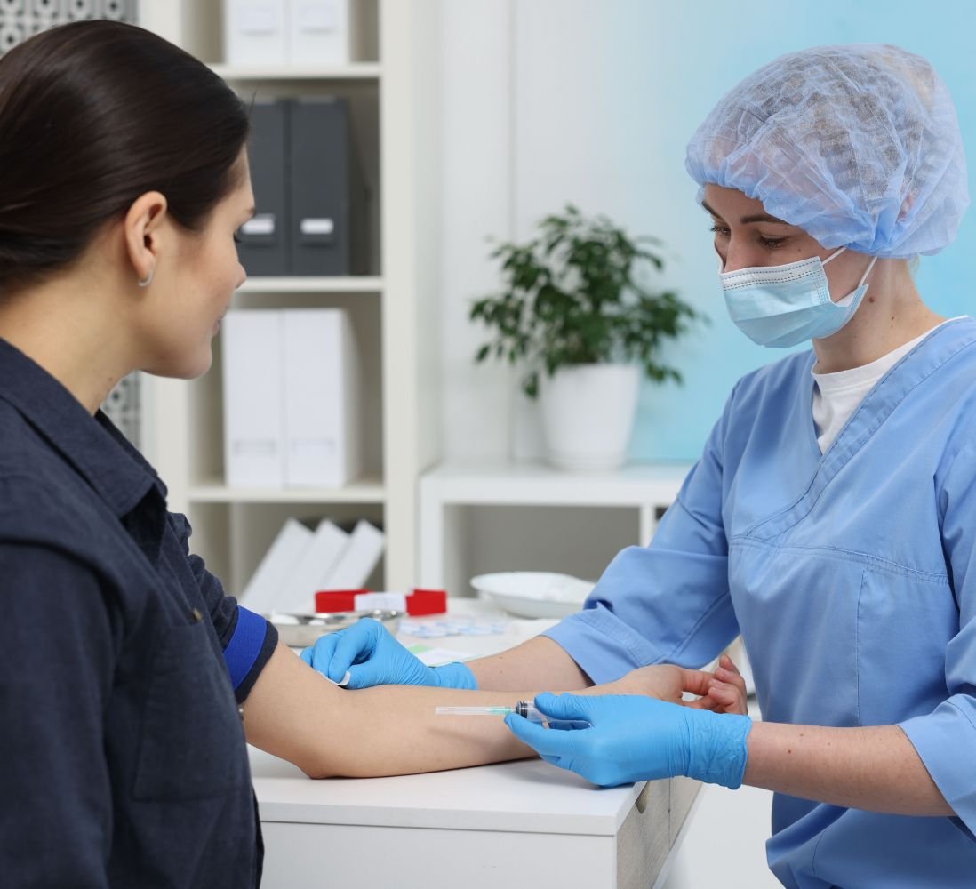 Nurse performing a biometric screening on an employee